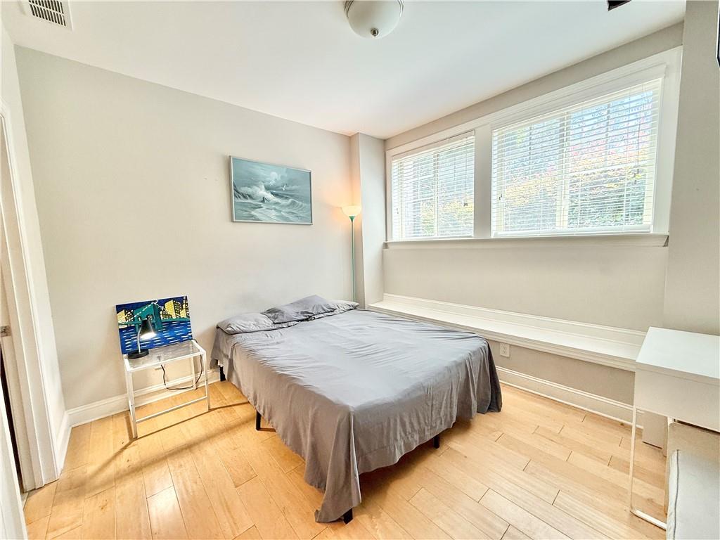 1817 Hislop Lane, Unit 7 Atlanta, GA 30345 - Photo 21 of 32 a spacious bedroom with a bed and a window