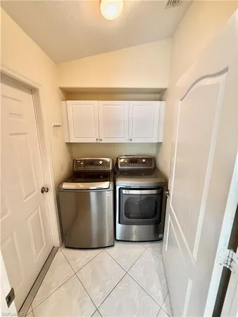 a kitchen with a stove and a microwave