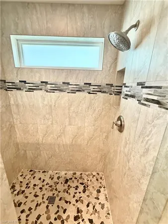 a large bathroom with a sink a mirror and vanity