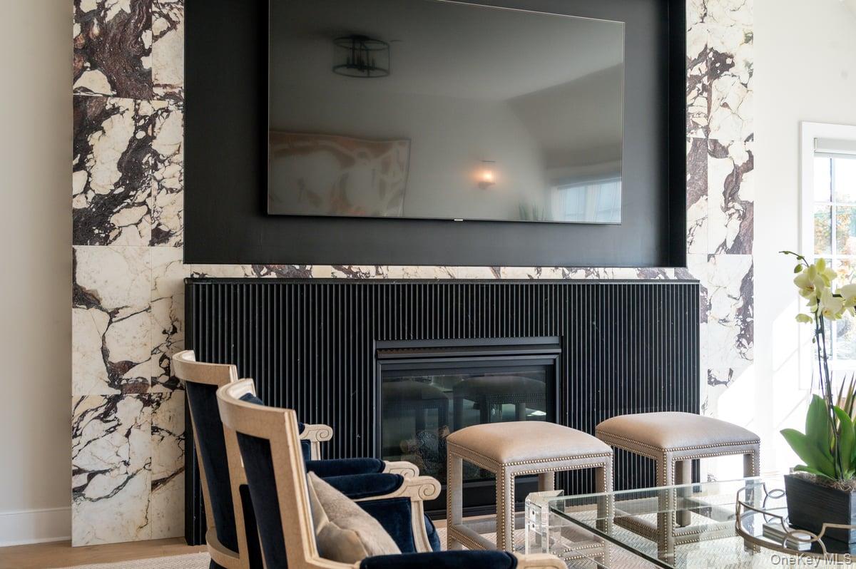 1 Primrose Lane Rye Brook, NY 10573 - Photo 16 of 42 Detailed view of a marble fireplace and wood finished floors