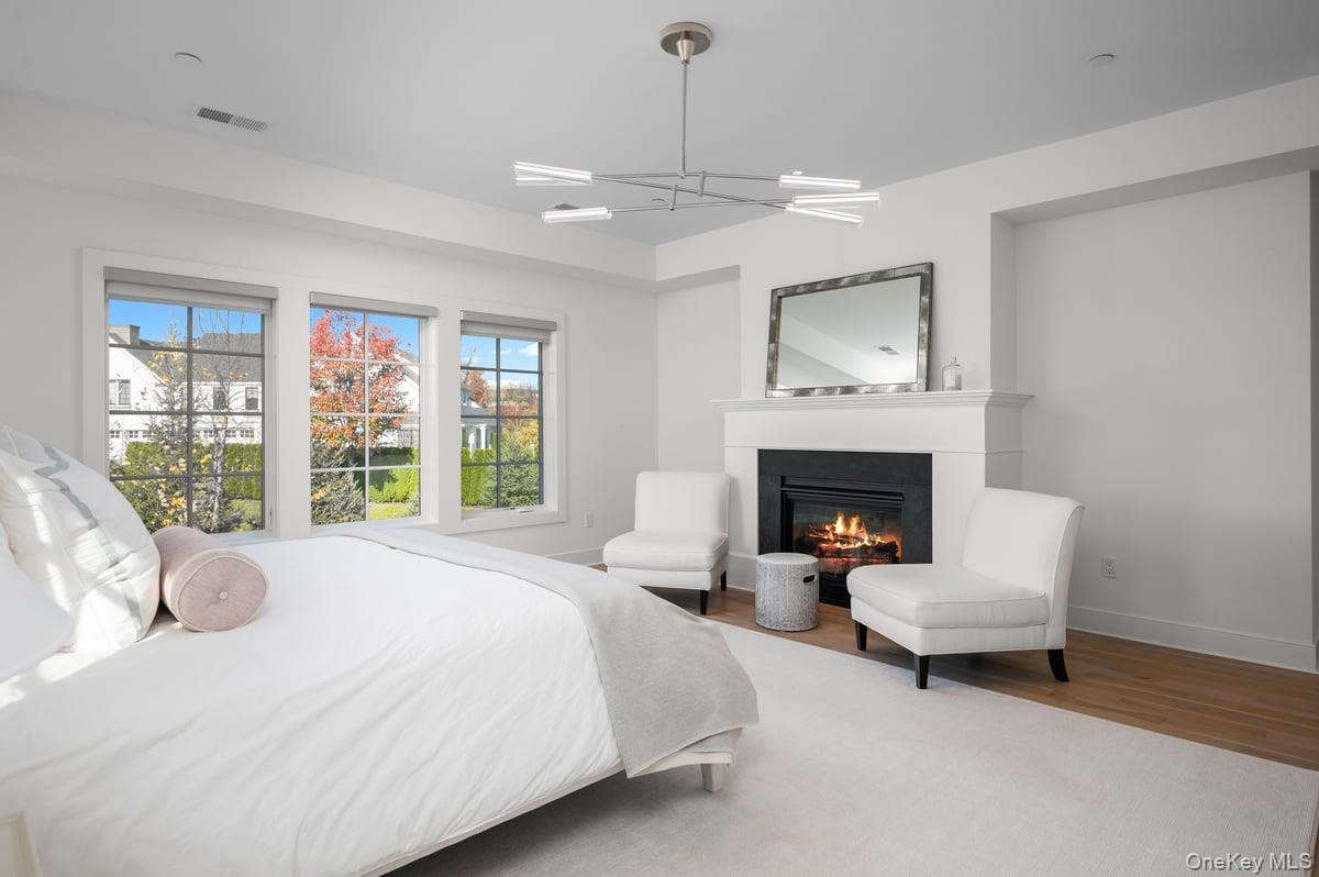 1 Primrose Lane Rye Brook, NY 10573 - Photo 20 of 42 Primary bedroom with fire place