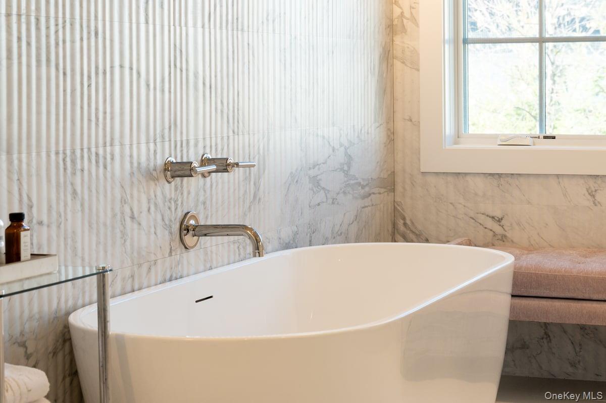 1 Primrose Lane Rye Brook, NY 10573 - Photo 25 of 42 Bathroom featuring tile walls and a freestanding bath