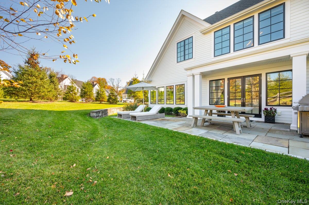 1 Primrose Lane Rye Brook, NY 10573 - Photo 33 of 42 View of green lawn featuring a patio area