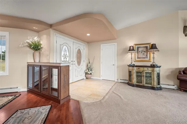 a view of a livingroom with furniture and a flat screen tv