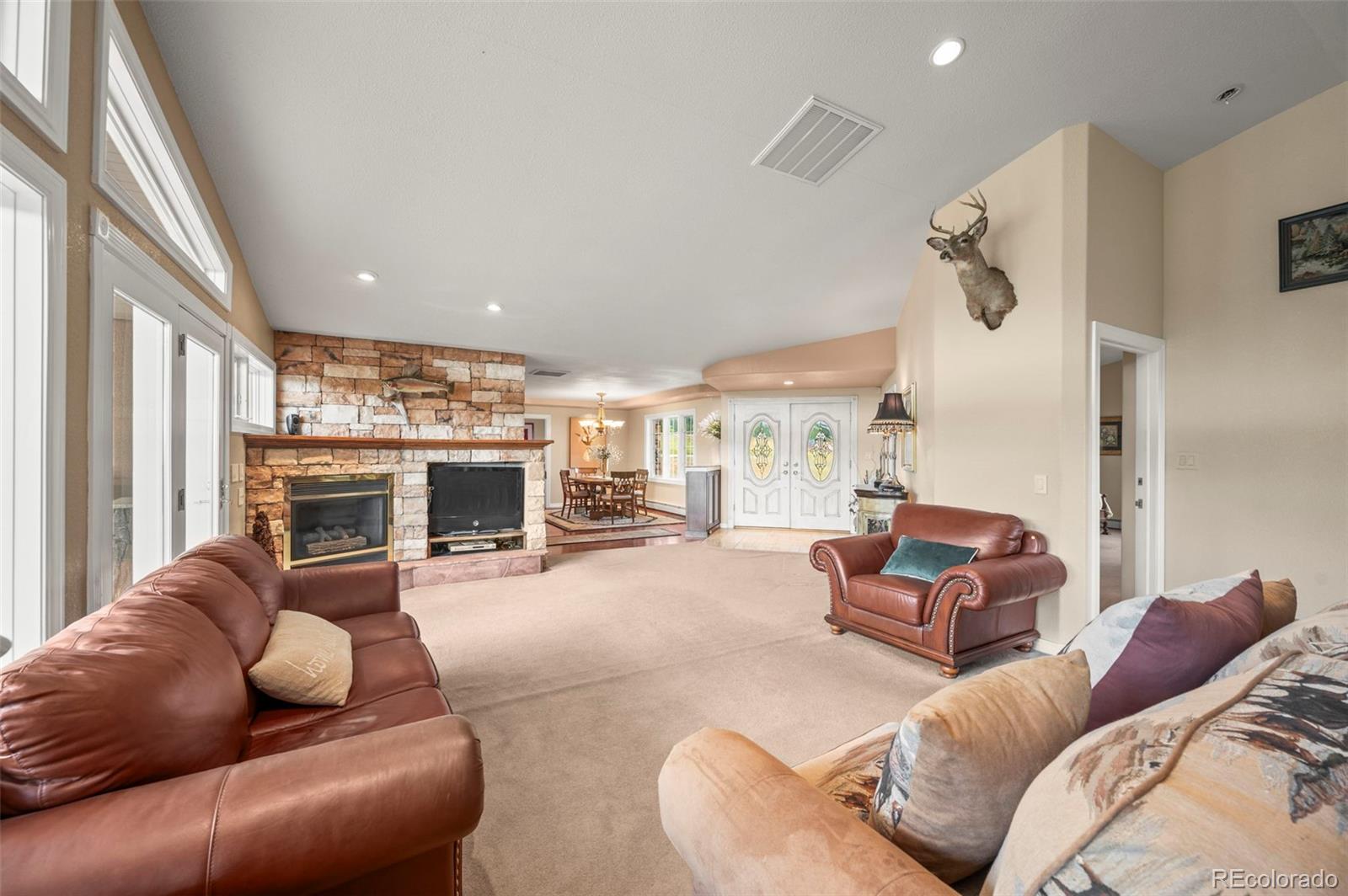10650 Baxter Road Rye, CO 81069 - Photo 13 of 50 a living room with furniture and a fireplace