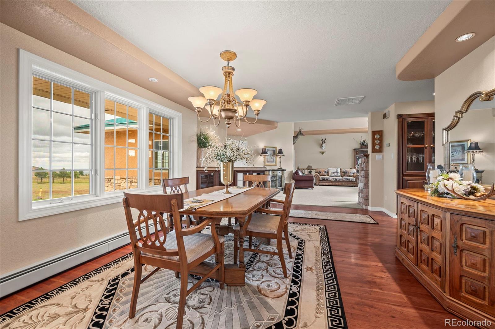 10650 Baxter Road Rye, CO 81069 - Photo 16 of 50 a view of a dining room with furniture window and wooden floor