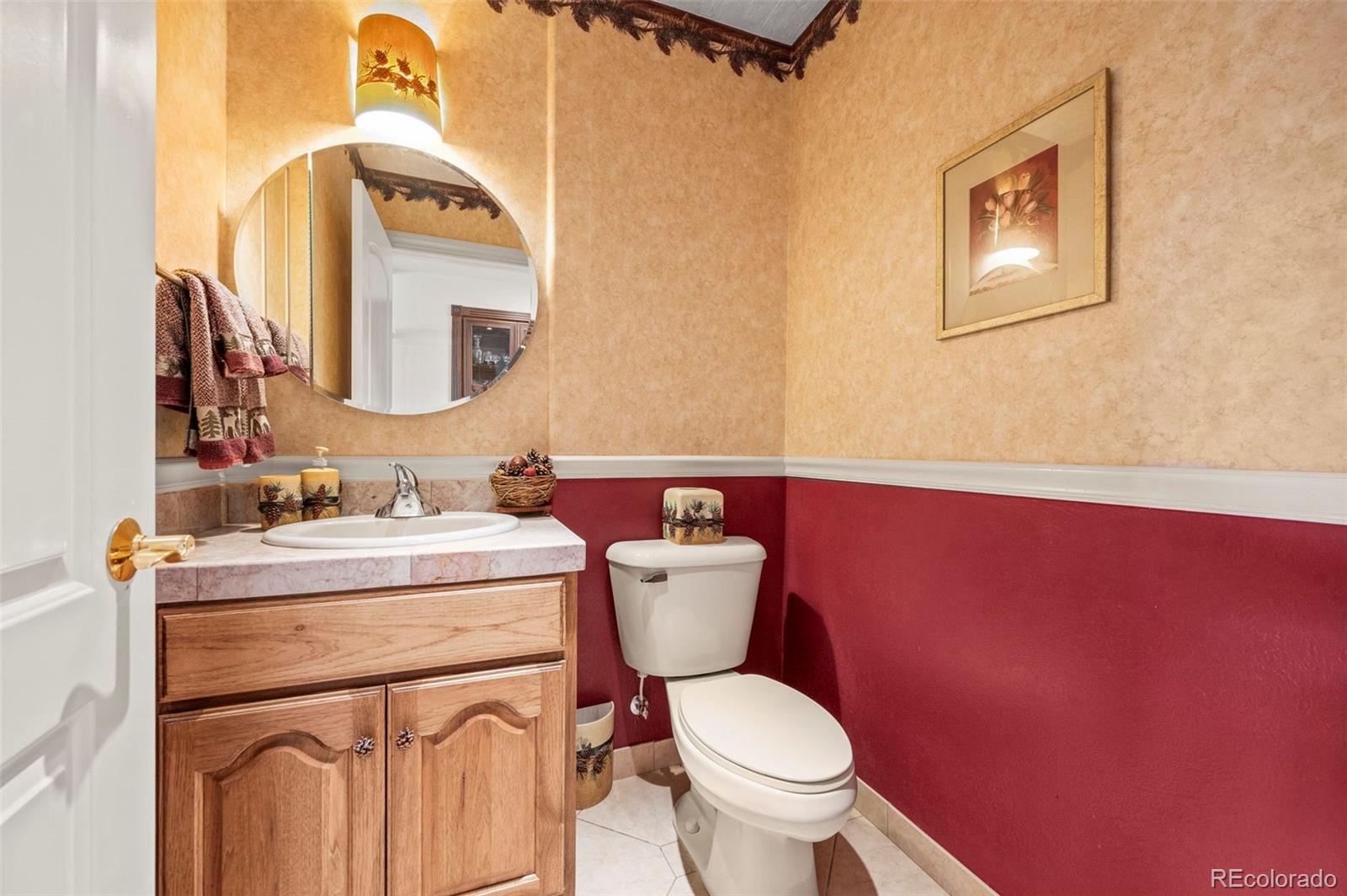 10650 Baxter Road Rye, CO 81069 - Photo 18 of 50 a bathroom with a toilet a sink and mirror