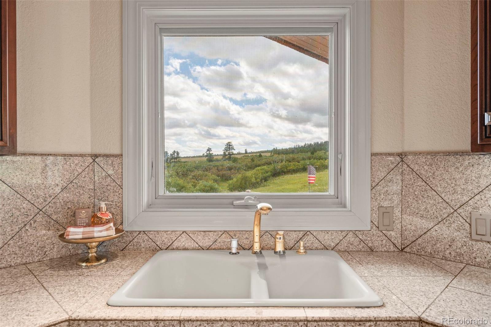 10650 Baxter Road Rye, CO 81069 - Photo 22 of 50 a bathroom with a bathtub and a sink