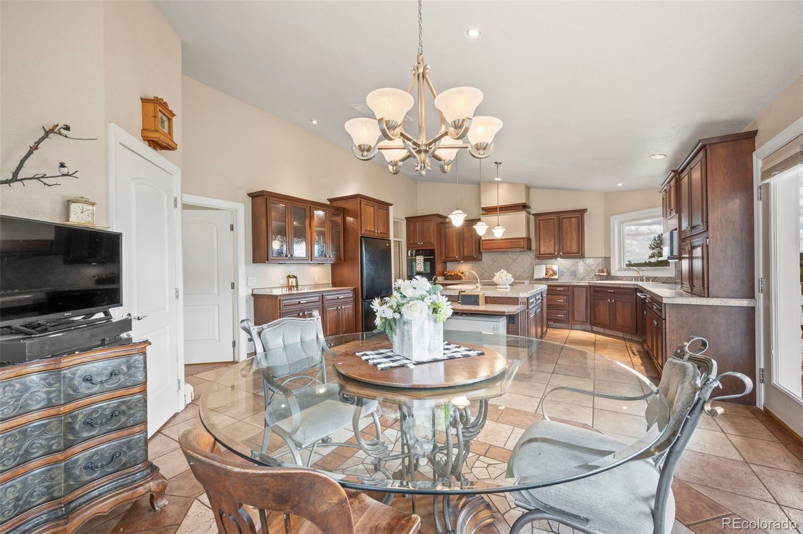10650 Baxter Road Rye, CO 81069 - Photo 25 of 50 a view of a dining room with furniture a chandelier and wooden floor
