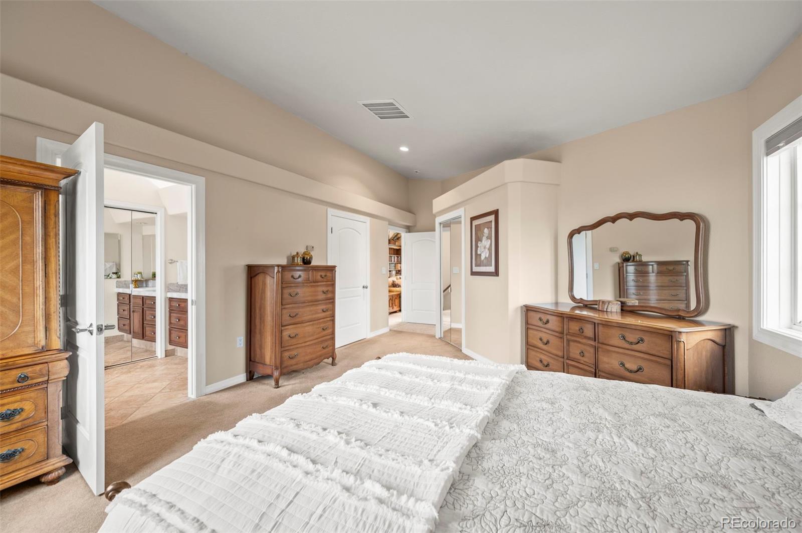 10650 Baxter Road Rye, CO 81069 - Photo 28 of 50 a bedroom with a bed dresser and a flat tv screen