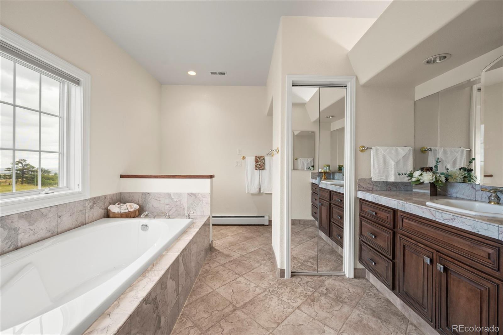 10650 Baxter Road Rye, CO 81069 - Photo 29 of 50 a spacious bathroom with a sink double vanity and a tub