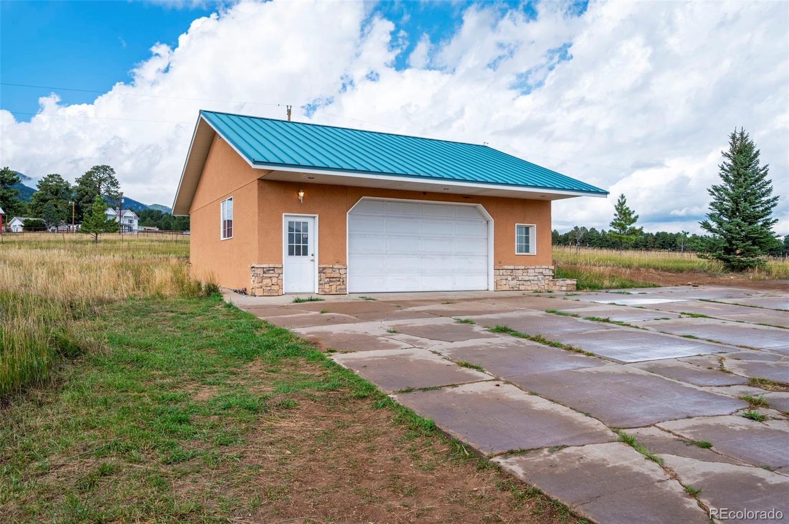 10650 Baxter Road Rye, CO 81069 - Photo 48 of 50 a front view of a house with garden