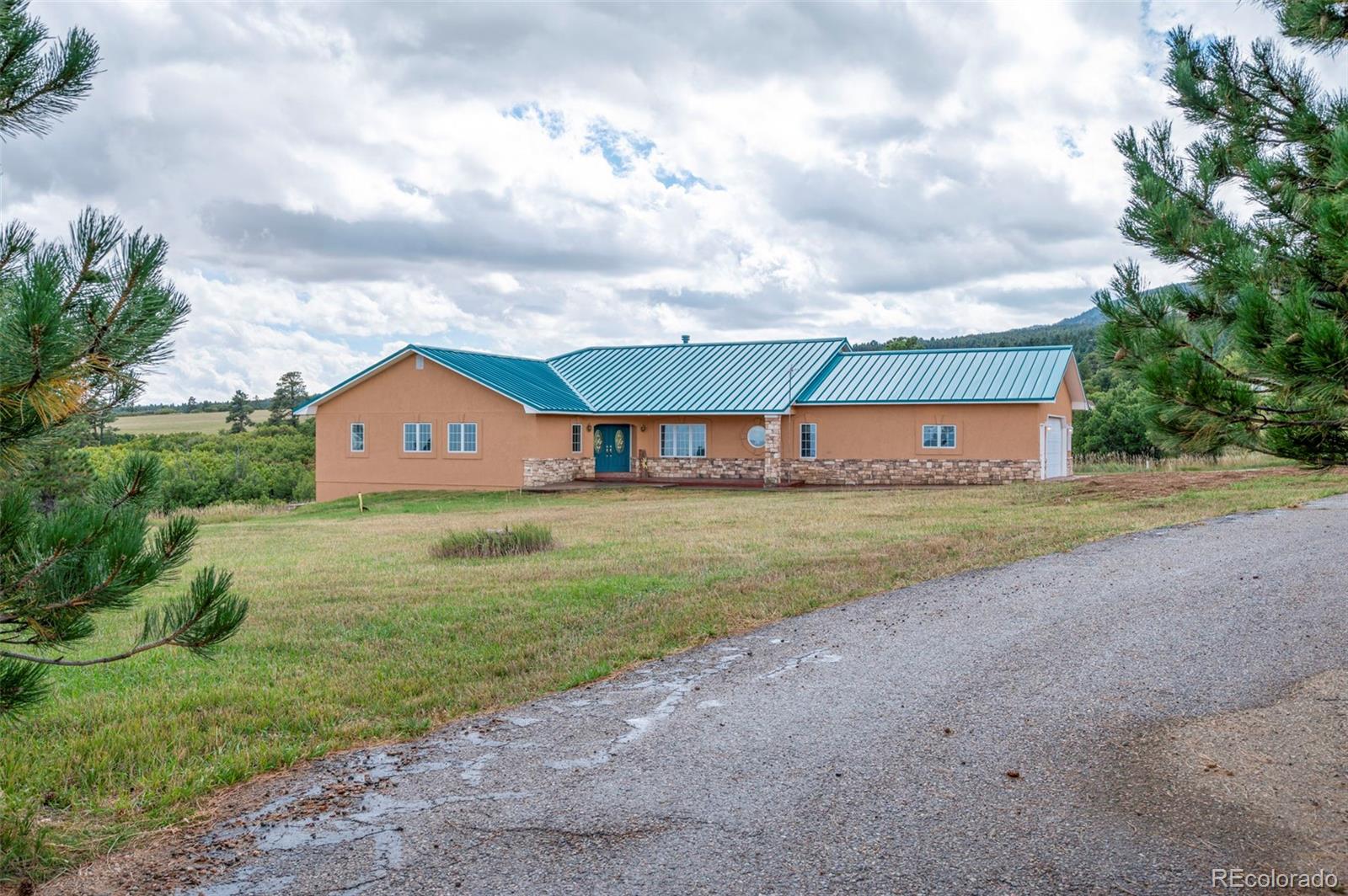 10650 Baxter Road Rye, CO 81069 - Photo 5 of 50 a front view of house with yard and garage