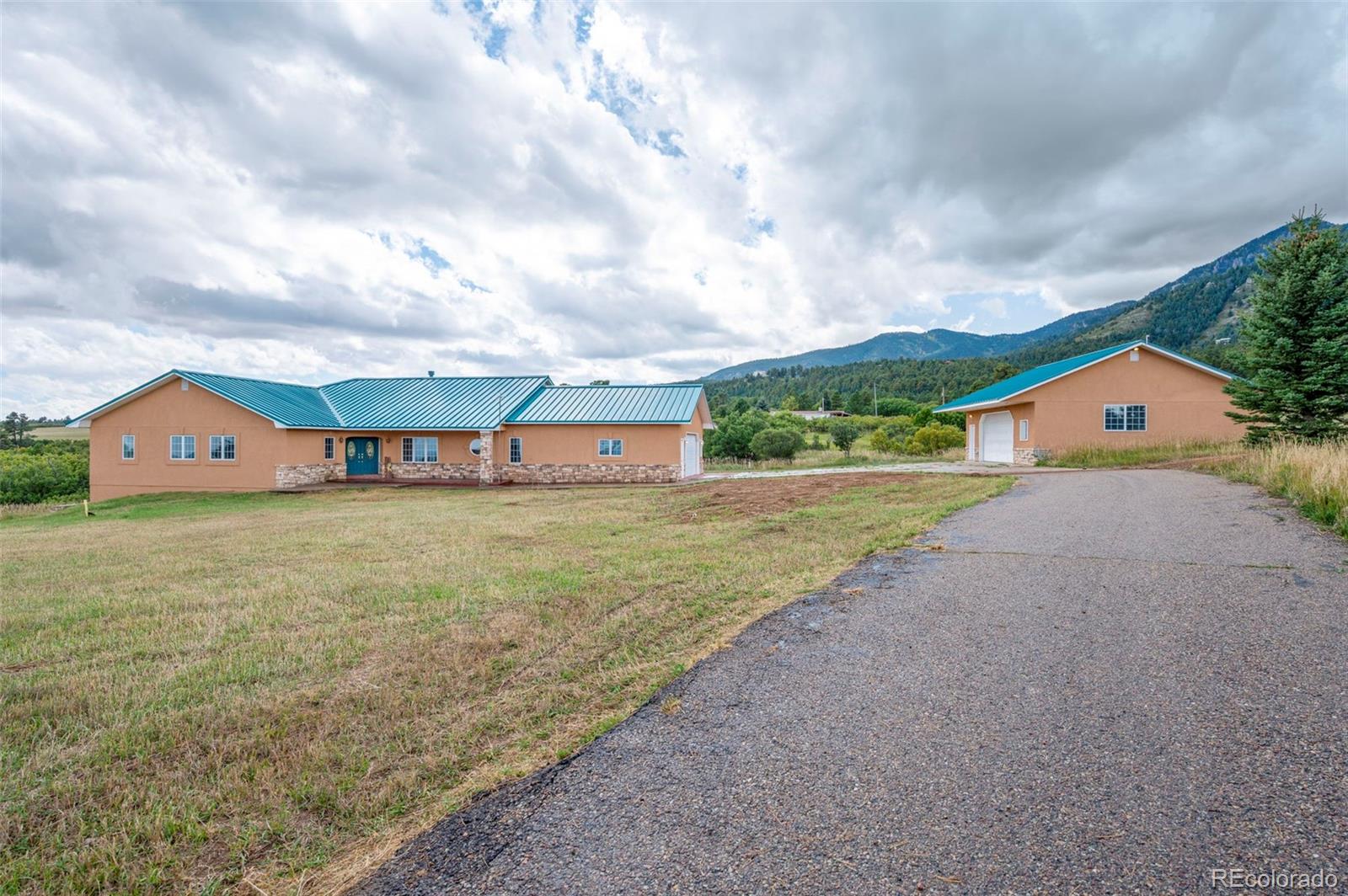 10650 Baxter Road Rye, CO 81069 - Photo 6 of 50 a view of a house with a yard and sitting area