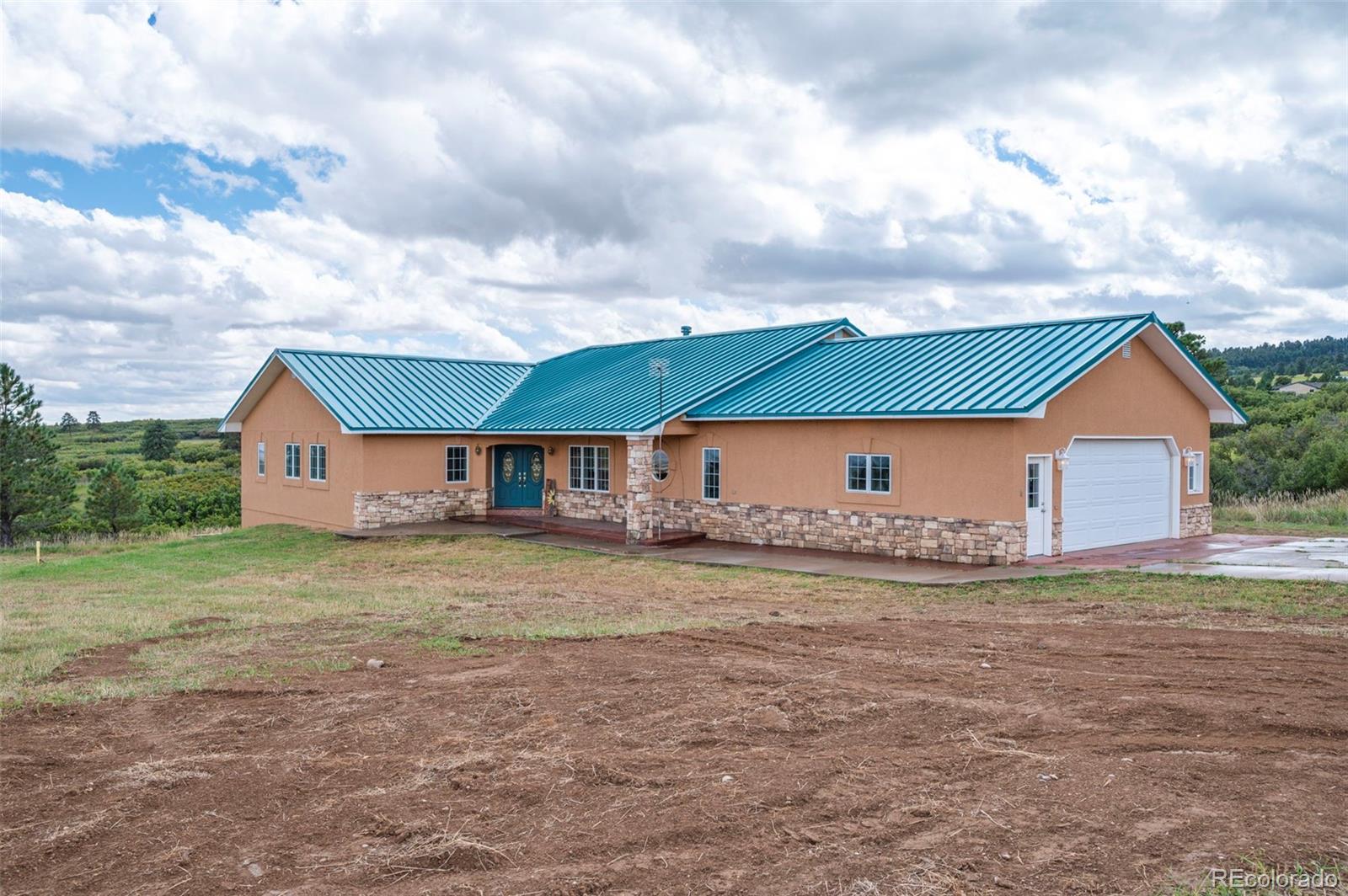 10650 Baxter Road Rye, CO 81069 - Photo 7 of 50 a front view of house with yard and garage