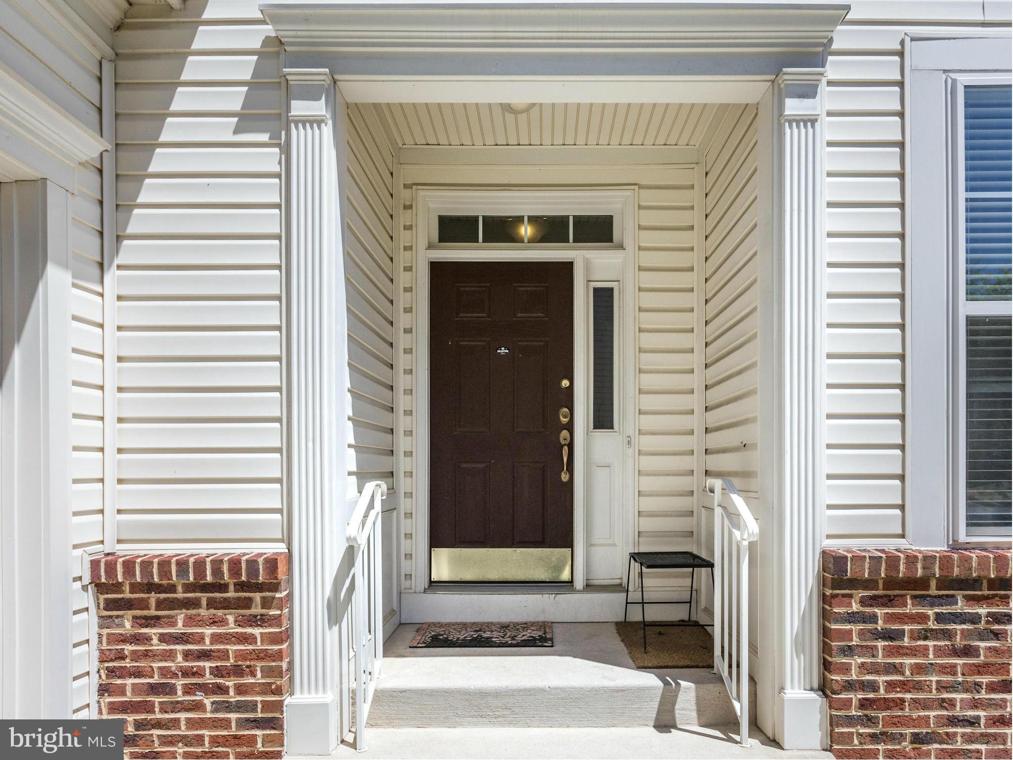 1893 Scaffold Way Odenton, MD 21113 - Photo 2 of 22 a front view of a house with a white door