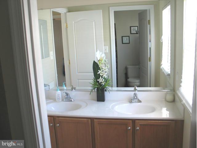 1893 Scaffold Way Odenton, MD 21113 - Photo 19 of 22 a bathroom with a sink and a mirror