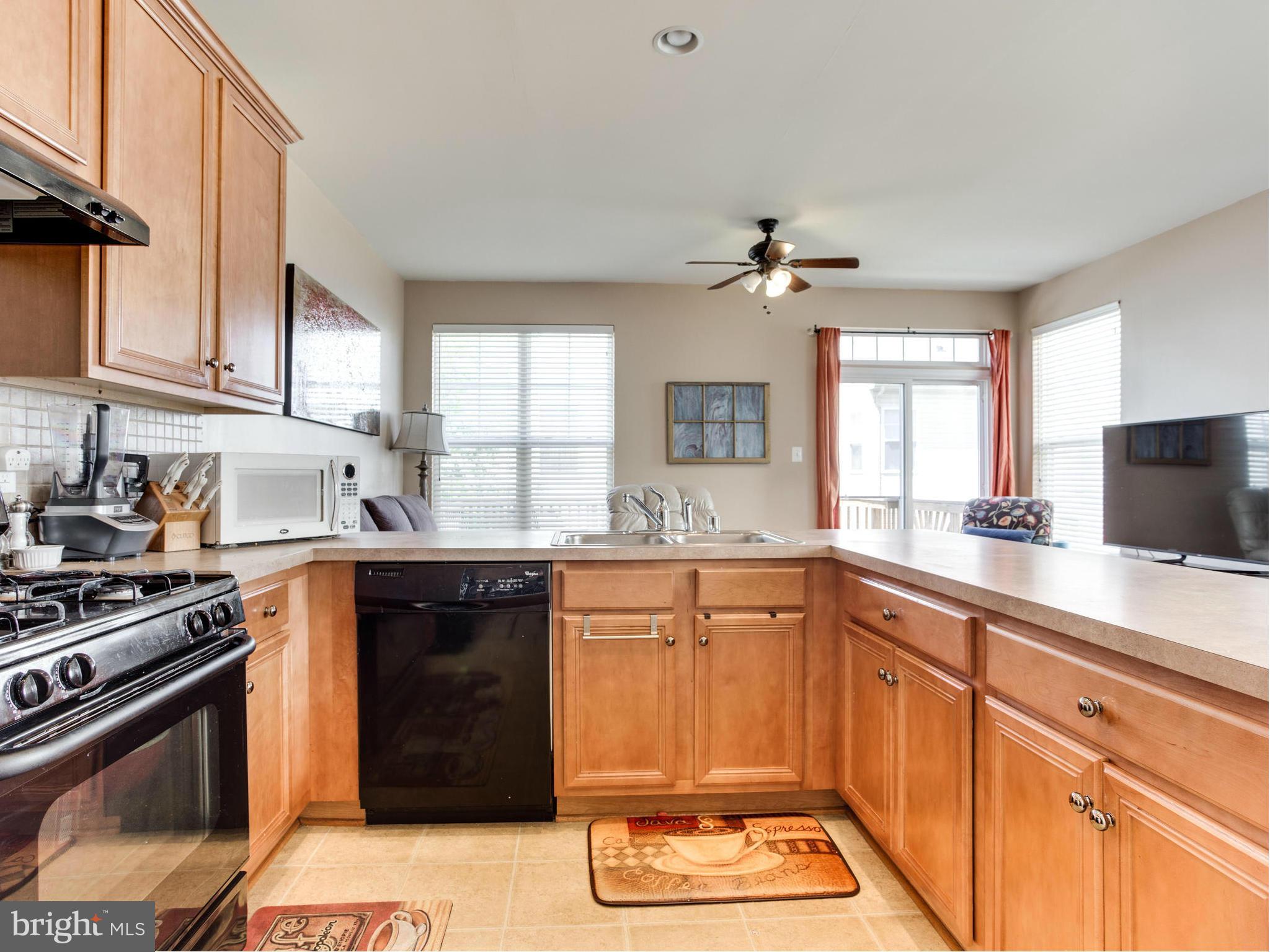 1893 Scaffold Way Odenton, MD 21113 - Photo 10 of 22 a kitchen with a sink stove and window