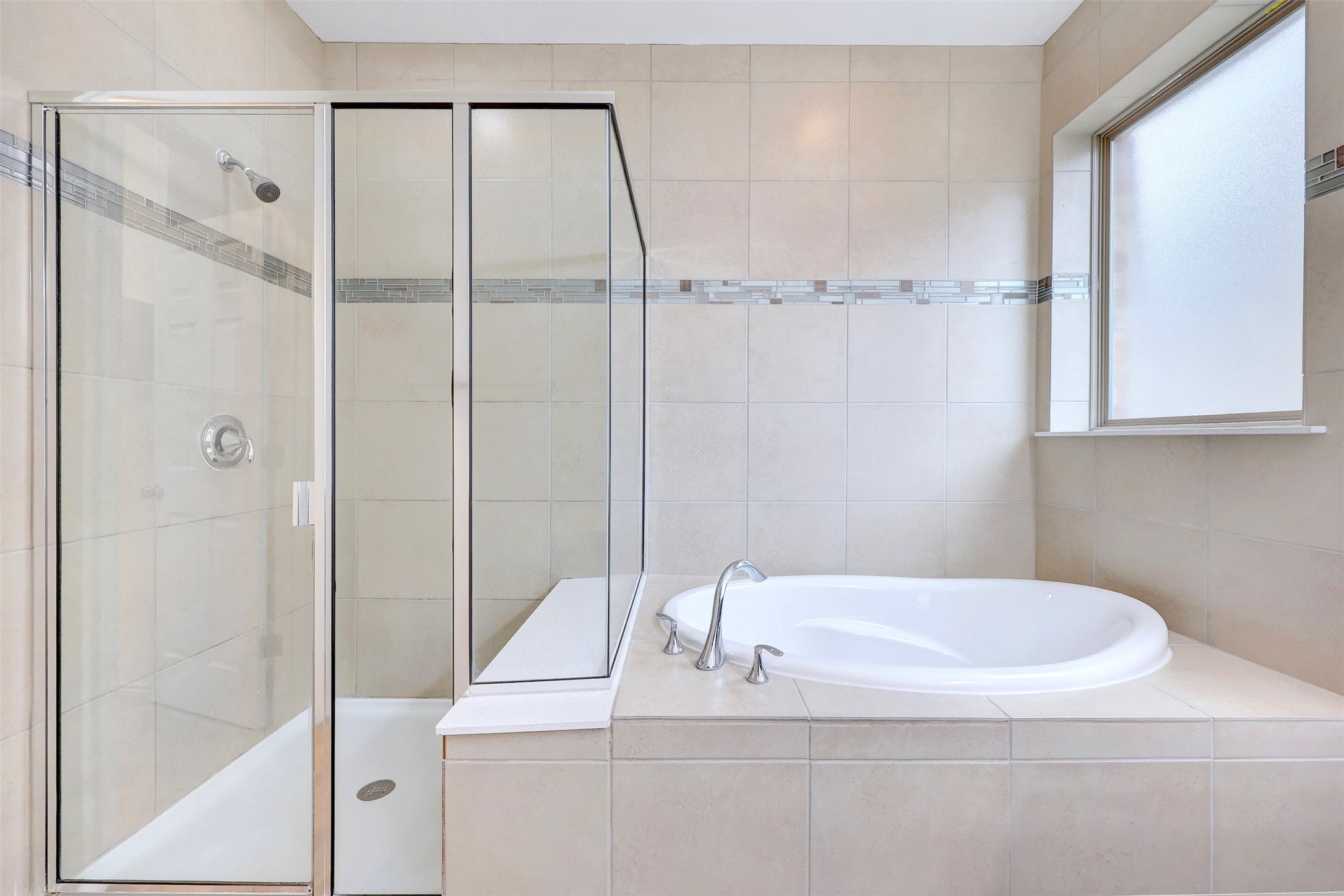 307 Simmental Loop Hutto, TX 78634 - Photo 19 of 34 Indulge in this bathroom featuring a spacious built-in tub and walk-in shower.
