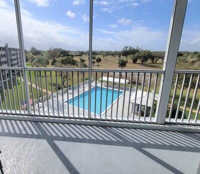 6699 Northwest 2nd Avenue, Unit PHI Boca Raton, FL 33487 - Photo 13 of 33 a view of a balcony next to a yard