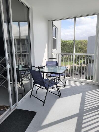 6699 Northwest 2nd Avenue, Unit PHI Boca Raton, FL 33487 - Photo 14 of 33 a view of a dining room with furniture window and outside view