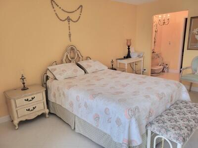 6699 Northwest 2nd Avenue, Unit PHI Boca Raton, FL 33487 - Photo 17 of 33 a bedroom with a bed and a window