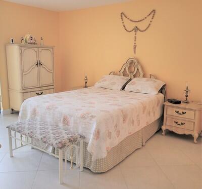 6699 Northwest 2nd Avenue, Unit PHI Boca Raton, FL 33487 - Photo 18 of 33 a bed room with a bed and a couch