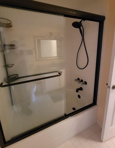 6699 Northwest 2nd Avenue, Unit PHI Boca Raton, FL 33487 - Photo 22 of 33 a bathroom with a shower and a white door