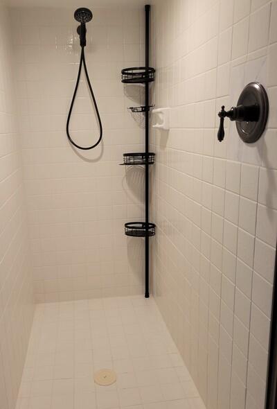 6699 Northwest 2nd Avenue, Unit PHI Boca Raton, FL 33487 - Photo 27 of 33 a bathroom with a shower