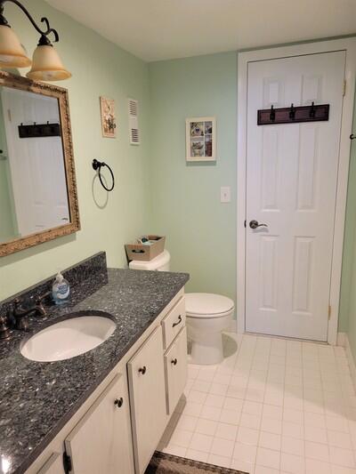 6699 Northwest 2nd Avenue, Unit PHI Boca Raton, FL 33487 - Photo 28 of 33 a spacious bathroom with a granite countertop sink toilet and shower