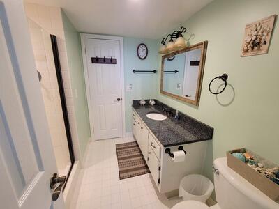 6699 Northwest 2nd Avenue, Unit PHI Boca Raton, FL 33487 - Photo 30 of 33 a bathroom with a sink and a mirror