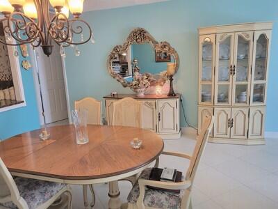 6699 Northwest 2nd Avenue, Unit PHI Boca Raton, FL 33487 - Photo 5 of 33 a view of a dining room with furniture and wooden floor