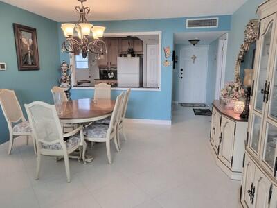 6699 Northwest 2nd Avenue, Unit PHI Boca Raton, FL 33487 - Photo 7 of 33 a view of a dining room with furniture and chandelier