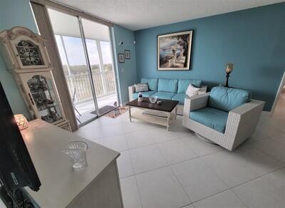 6699 Northwest 2nd Avenue, Unit PHI Boca Raton, FL 33487 - Photo 9 of 33 a living room with furniture and a large window