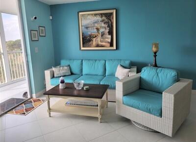 6699 Northwest 2nd Avenue, Unit PHI Boca Raton, FL 33487 - Photo 10 of 33 a living room with furniture and a potted plant