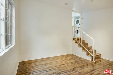 a view of entryway with wooden floor