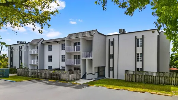 a view of a house with swimming pool in front of it