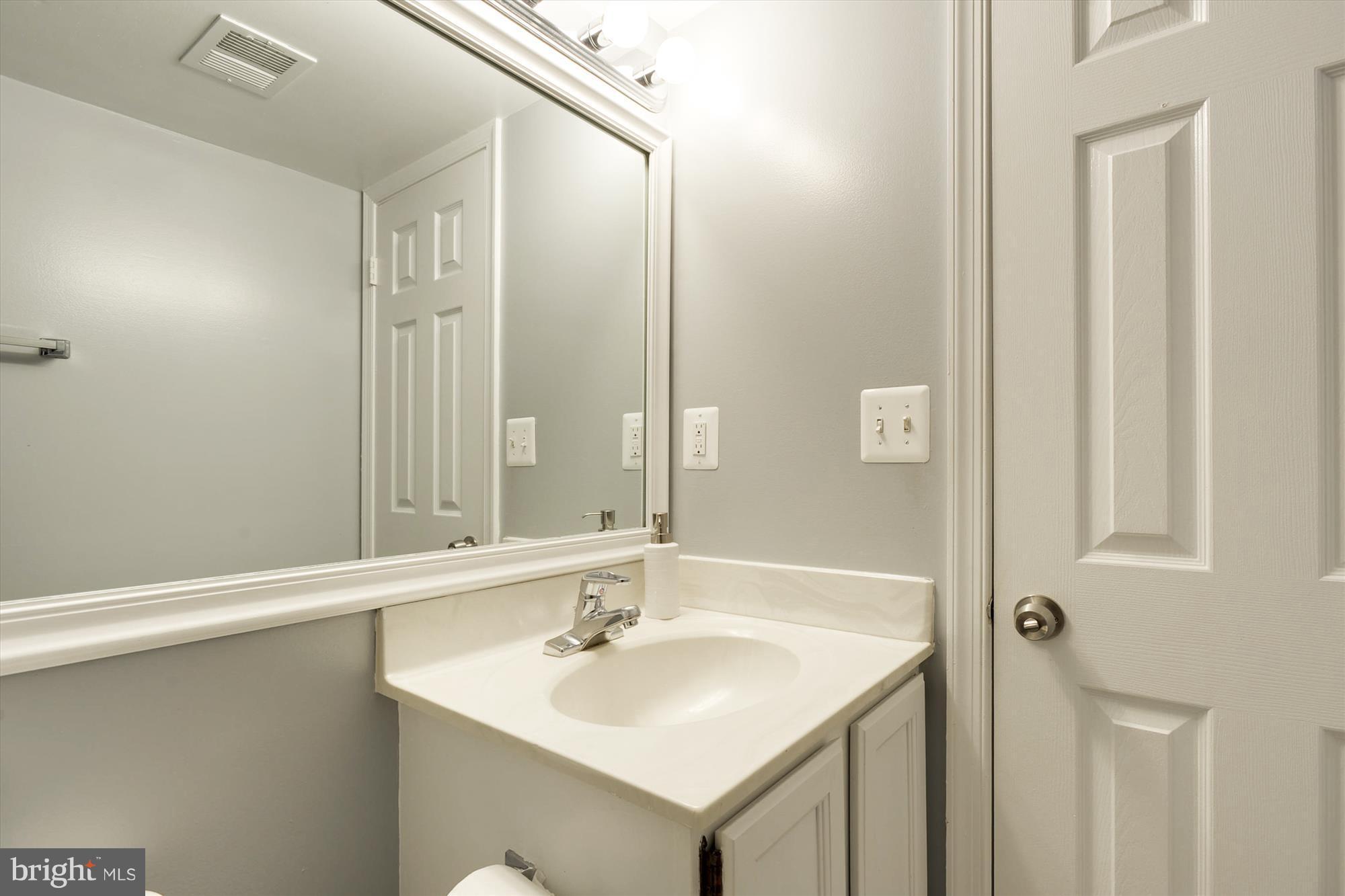 8428 Springfield Oaks Drive Springfield, VA 22153 - Photo 21 of 30 Convenient powder room on lower level