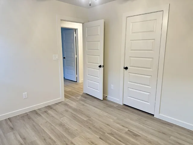 an empty room with wooden floor