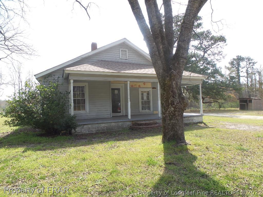 2011 Reservation Road Aberdeen, NC 28315 - Photo 1 of 8 a view of a house with a yard
