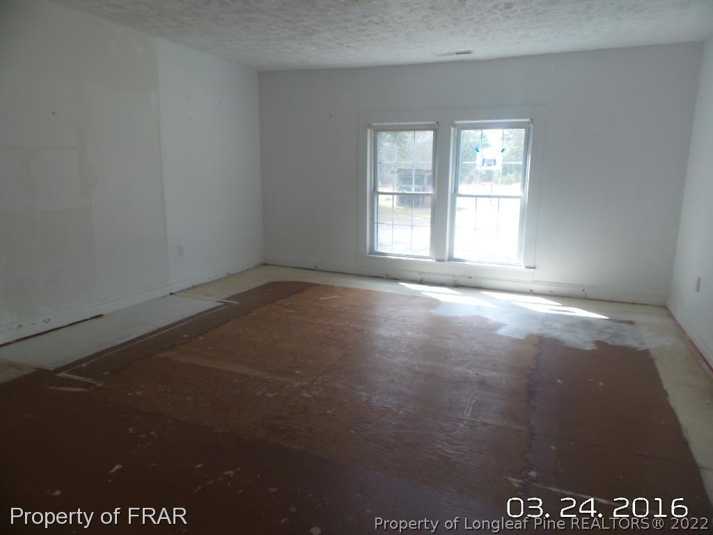 2011 Reservation Road Aberdeen, NC 28315 - Photo 5 of 8 an empty room with a window