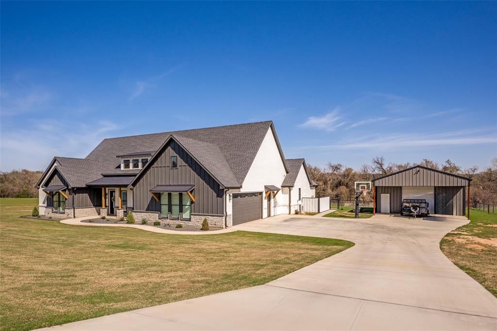 123 Proctor Lane Decatur, TX 76234 - Photo 1 of 25 a house with trees in front of it