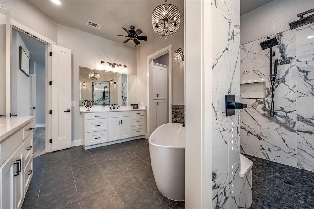 123 Proctor Lane Decatur, TX 76234 - Photo 14 of 25 a large white room with mirror and shower