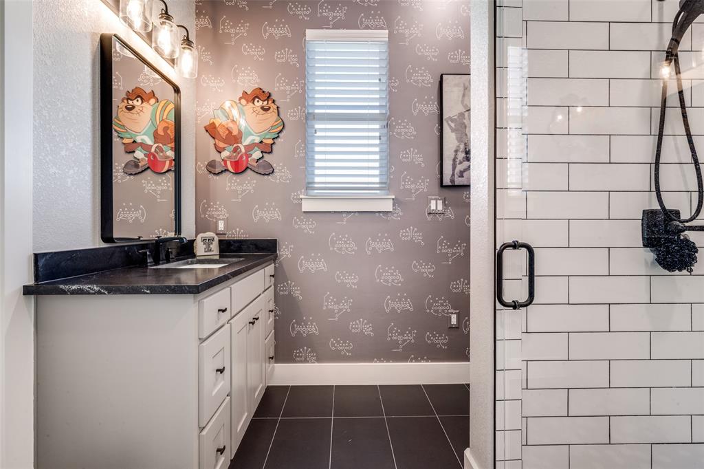 123 Proctor Lane Decatur, TX 76234 - Photo 16 of 25 a bathroom with a granite countertop sink a mirror and shower