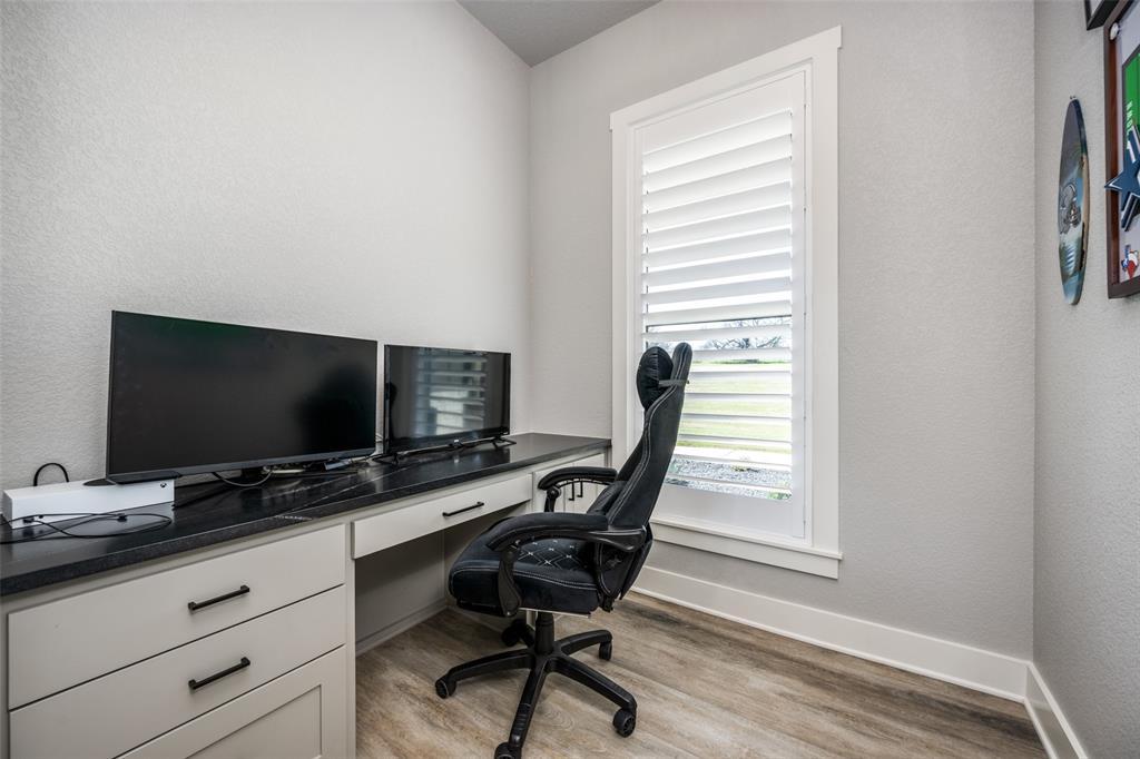 123 Proctor Lane Decatur, TX 76234 - Photo 19 of 25 a view of a workspace with furniture and a window