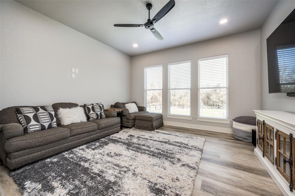 123 Proctor Lane Decatur, TX 76234 - Photo 20 of 25 a living room with furniture and a window