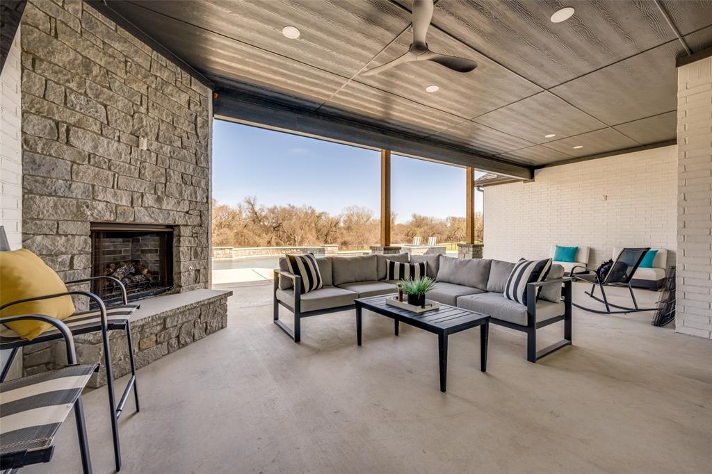 123 Proctor Lane Decatur, TX 76234 - Photo 22 of 25 a living room with furniture and a fireplace