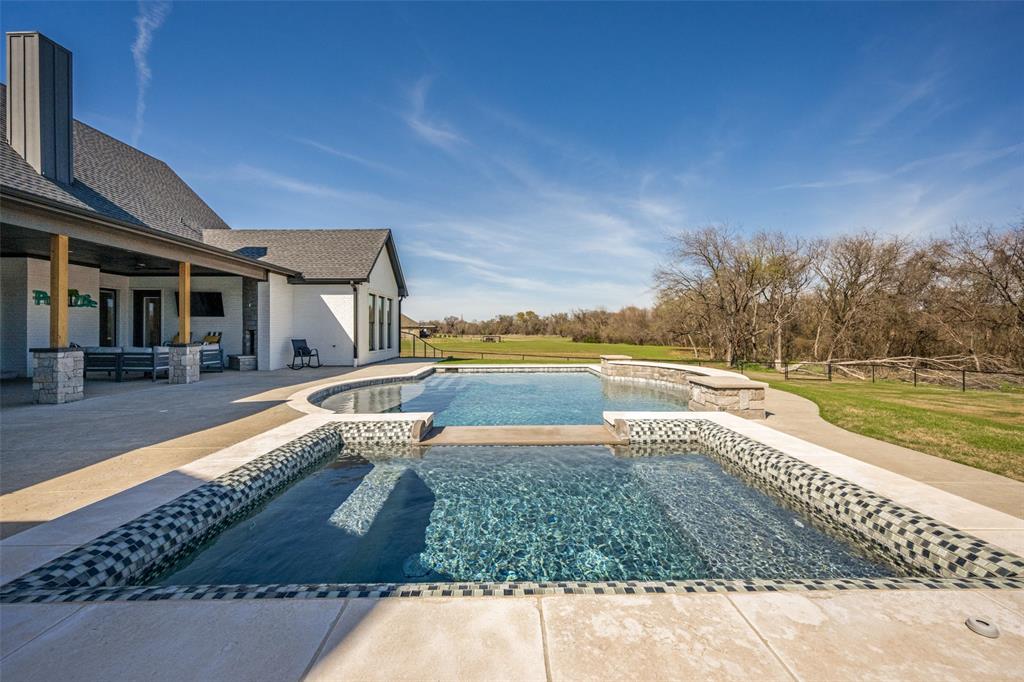 123 Proctor Lane Decatur, TX 76234 - Photo 24 of 25 a view of a swimming pool with an outdoor space and seating area