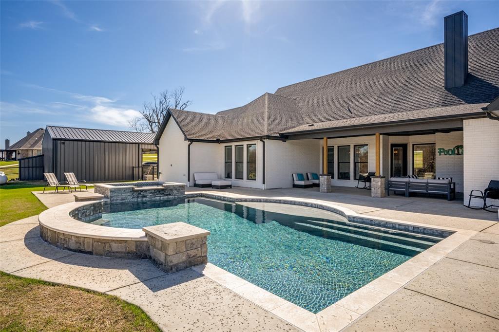 123 Proctor Lane Decatur, TX 76234 - Photo 25 of 25 a front view of a house with swimming pool having outdoor seating