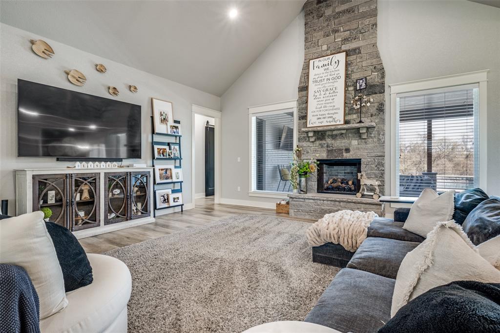 123 Proctor Lane Decatur, TX 76234 - Photo 3 of 25 a living room with furniture and a flat screen tv
